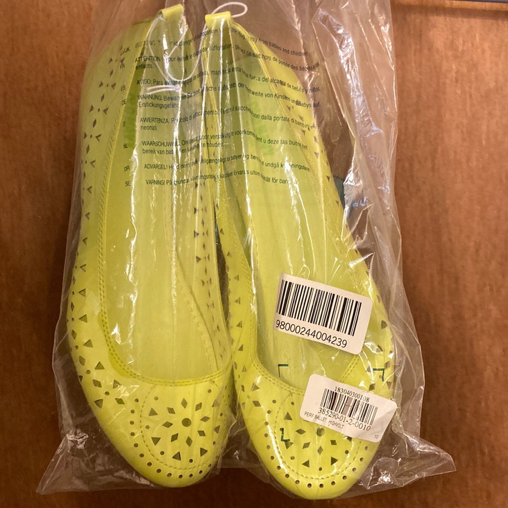 Neon green perforated flats